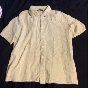 Iight green button up shirt